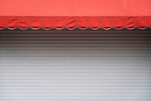 White stall with red sunshade