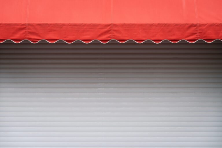 White stall with red sunshade